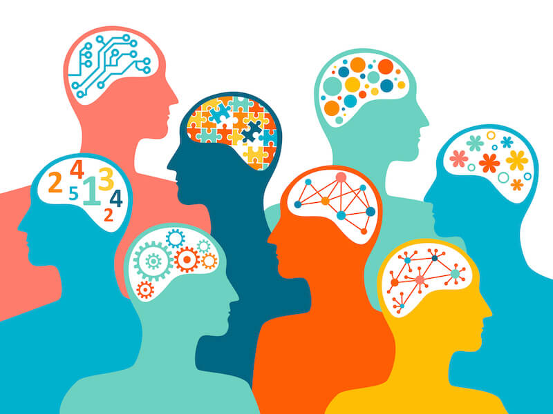 Illustration of diverse silhouetted heads with various designs inside: gears, puzzles, circuits, numbers, and flowers. Represents diverse thinking and creativity.